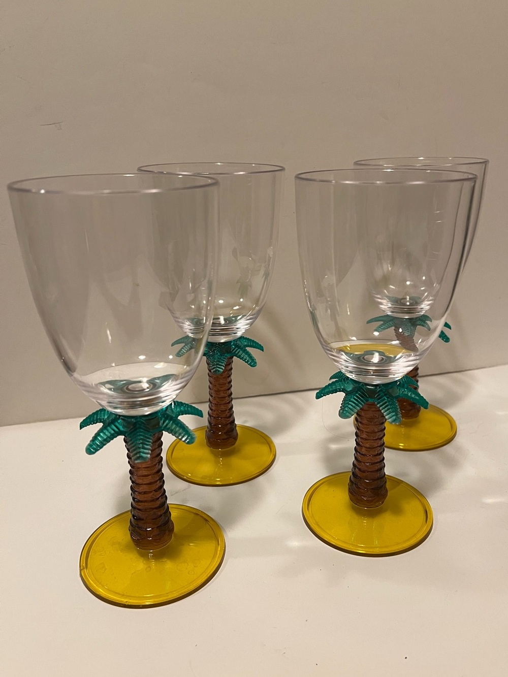 LOT OF 4 TROPICAL PALM TREE STEM WINE GLASSES.